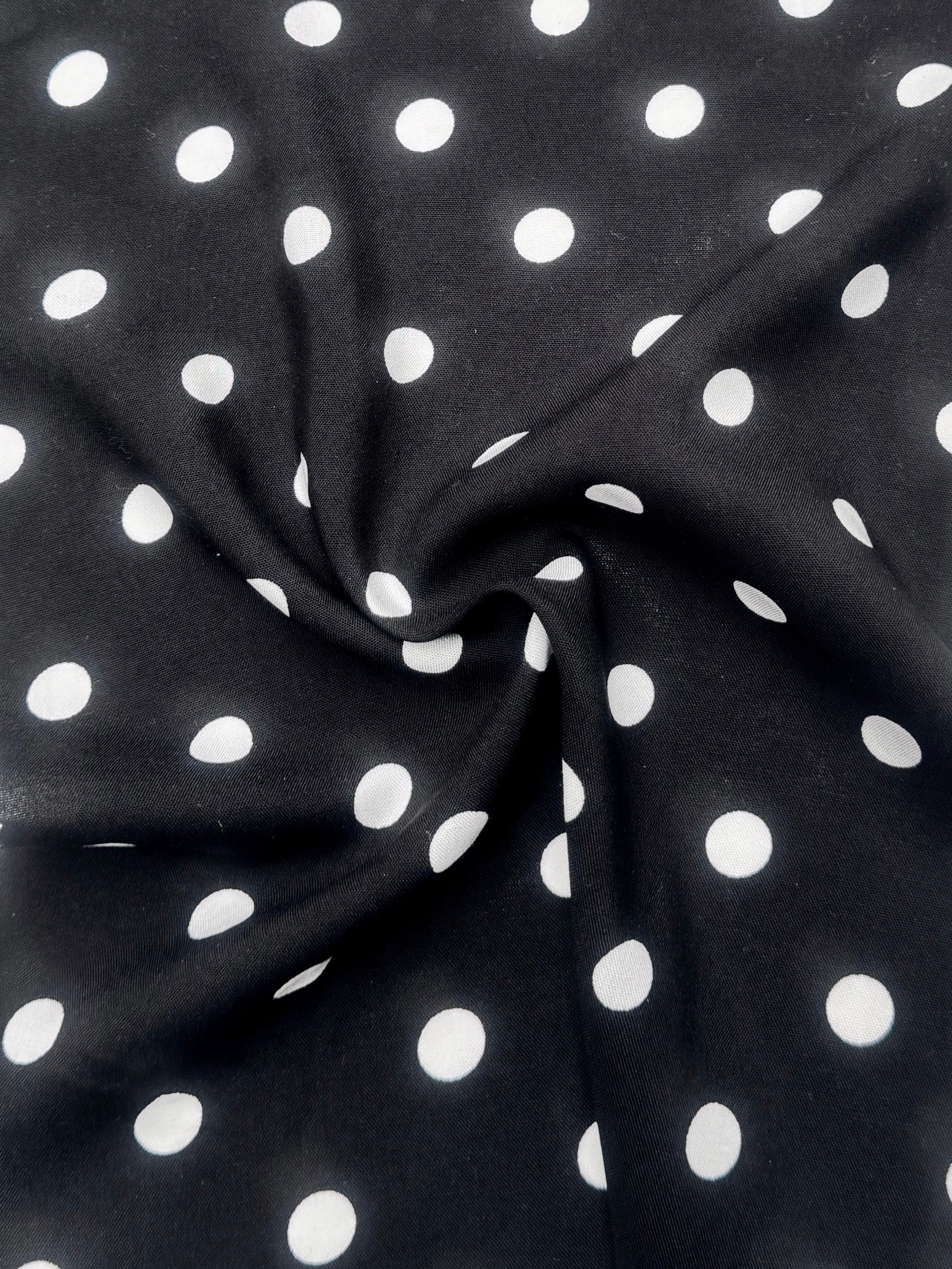 White polka dots on black rayon challis
